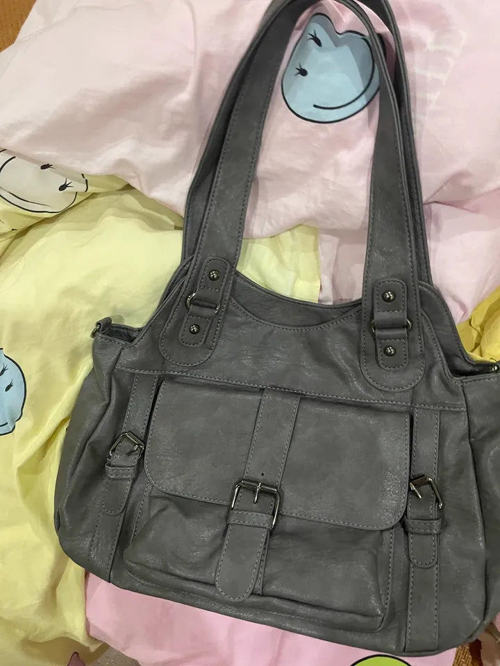 Gray handbag on a colorful background