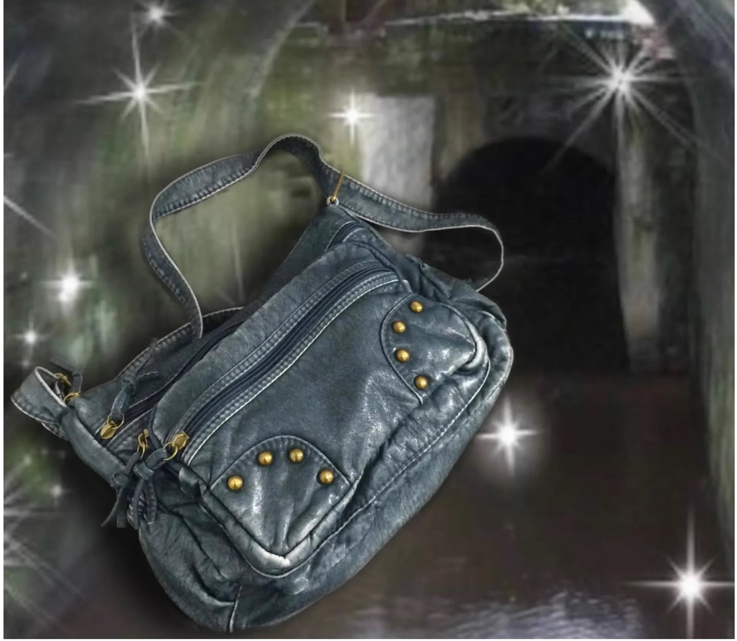Denim bag with gold studs on a dark background