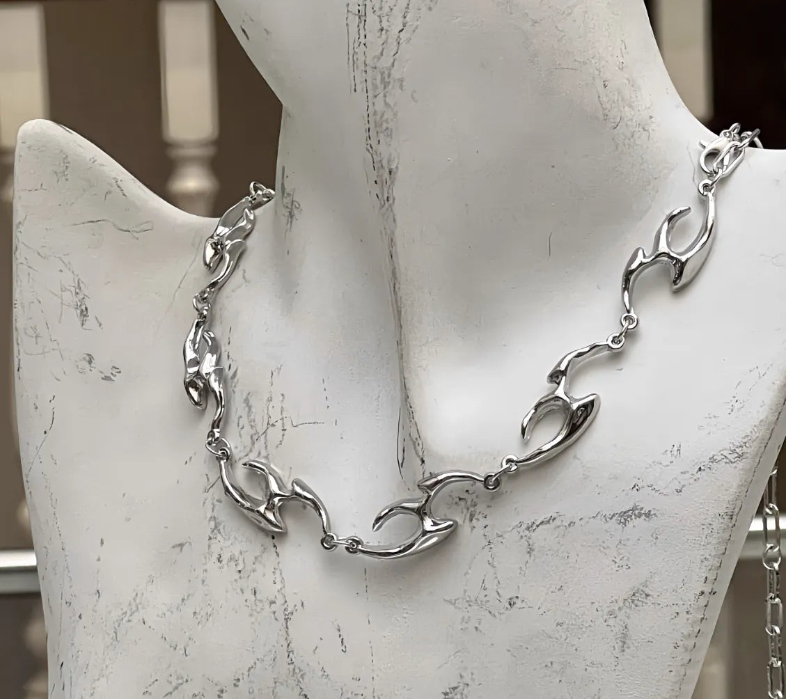 Silver necklace on a mannequin bust